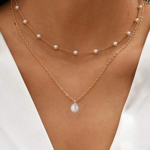 Elegant gold double-layer necklace featuring white pearl pendants for a sophisticated look