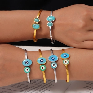 Bohemian evil eye bangle in gold and silver finish with natural stone and enamel inlay