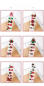 Detailed display of six Christmas hair clip sets featuring Santa hats and snowmen