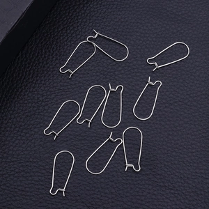 Polished silver titanium steel earring hooks for DIY jewelry making on a black background
