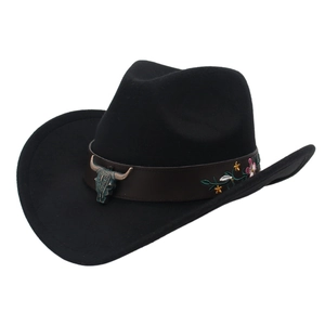 Detail of western cowboy hat with leather band, bull head ornament and floral embroidery