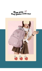 Detail of light purple waterproof nylon backpack with bear charm and multi-pocket design