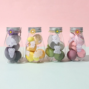 Set of 4 colorful makeup sponges in daisy-themed clear jars with cute bear stickers