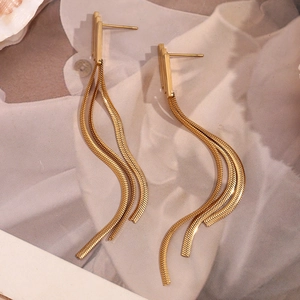 Macro shot of 18K gold plated multi-layer snake chain tassel earrings for women