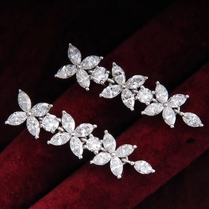 Elegant marquise cubic zirconia long flower earrings with silver plated finish on red velvet