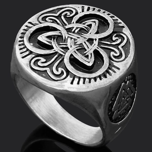 Detailed macro view of vintage Viking Thor Hammer wolf ring with Celtic knot engravings