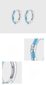 Detail of S925 sterling silver hoop earrings with blue enamel and pavé cubic zirconia
