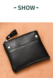 Detail view of black PU coin purse with silver rivets, zipper closure and wrist strap