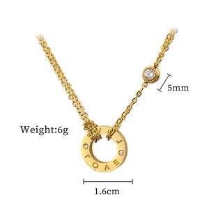 Detailed view of gold LOVE pendant with dimensions 1.6cm and 5mm sparkling stones