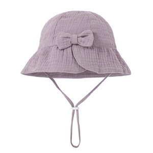 Detail of lilac cotton baby sun hat with bow decoration and adjustable windproof strap