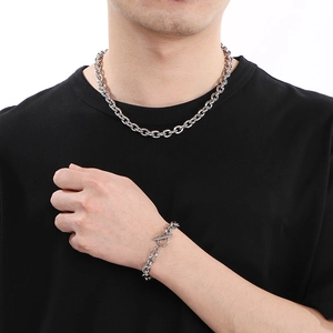 Men's silver stainless steel OT buckle necklace and bracelet set on model