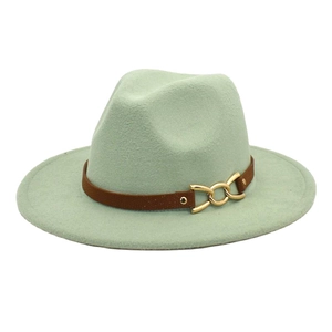Detail of mint green fedora wool hat featuring brown leather belt and gold metal buckle