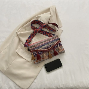 Bohemian crossbody bag detail showing ethnic woven patterns and colorful tassels