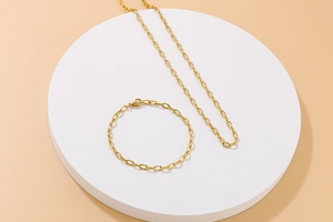 Detailed view of gold hammered rectangle link chain necklace and bracelet set