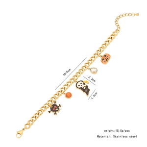 Detail of Halloween gold stainless steel bracelet with ghost and pumpkin charms