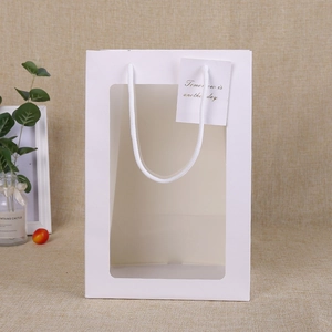 Elegant white paper gift bag with transparent window and rope handle for plush toys
