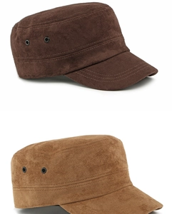 Detailed view of suede cadet caps in brown and beige with metallic eyelets and stitching