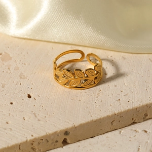 18k gold plated stainless steel leaf ring with olive branch design on a stone base