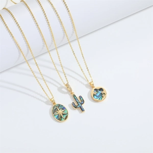 Virgin Mary necklaces with golden borders and natural abalone shells on white background