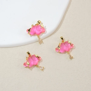 Detail showing pink cloud pendants with gold lightning accents and clear crystal drops