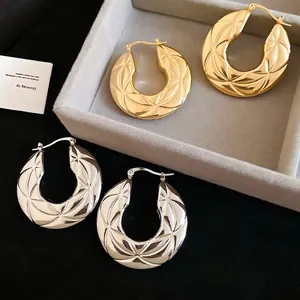 Minimalist quilted pattern round hoop earrings in gold and silver with hinged snap closure