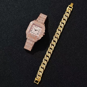 Close-up of rose gold square watch and Cuban bracelet set with full diamond paving