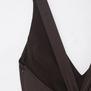 Elegant black satin sleeveless maxi dress featuring a deep V-neck and slimming backless design