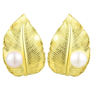 Detailed view of golden leaf earrings with white pearls and delicate vein textures
