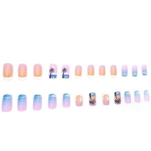 French tip press-on nails with tropical sunset gradient and black palm tree silhouettes