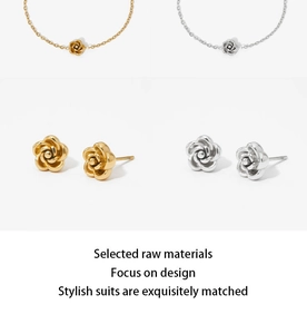 Detail view of flower necklace and earring set in polished gold and silver finishes