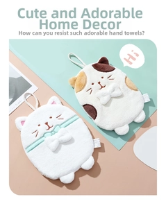 Detail of hanging cat hand towels with soft coral fleece texture and 3D bow ties