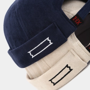 Close-up of embroidered Docker Cap with vintage THX label and premium velvet texture