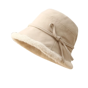 Beige faux suede winter bucket hat with plush faux fur trim and side bow detail