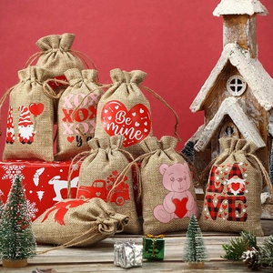 Linen drawstring gift bags with heart and gnome prints for Valentine party favors