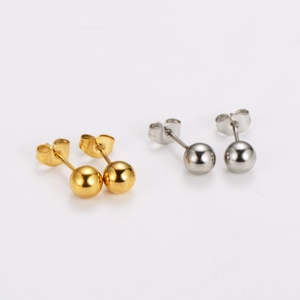 Gold and silver stainless steel ball stud earrings with butterfly backs on white background