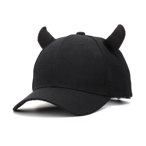 Detailed view of black cotton baseball cap featuring 3D small devil horn decorations