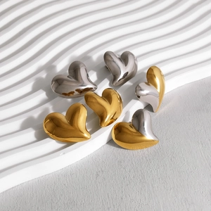 Polished 18K gold and silver heart-shaped stud earrings in assorted metallic finishes