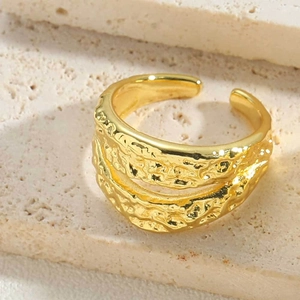 Detailed close-up of 14K gold plated ring with a unique hammered texture finish