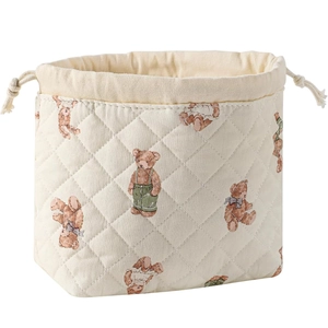 Beige quilted cotton makeup bag with cute teddy bear pattern and drawstring closure