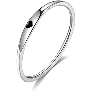 Macro detail of slim stainless steel ring featuring a black enamel heart decoration