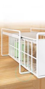 Close-up of pull-out kitchen basket with smooth slide rails and protective foot pads