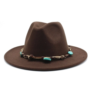 Close-up of brown wool fedora with bohemian braided band and turquoise stone accents