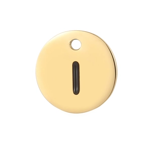 Macro view of a gold circular stainless steel pendant with a black vertical line detail