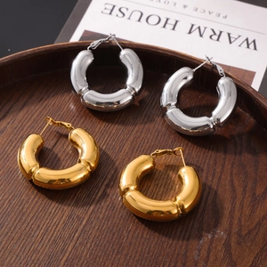 Polished C-shape bamboo joint earrings in gold and silver finish with metallic luster