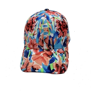Detail of colorful baseball cap featuring vibrant floral patterns and reinforced stitching