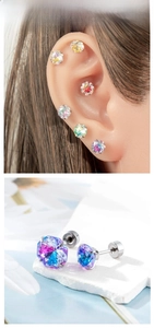 Detail view of colorful gradient zircon stud earrings in 6mm and 8mm sizes for ear cartilage