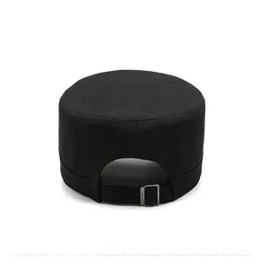 Rear view of black cotton cadet cap showing the adjustable metal buckle closure strap