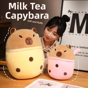 Close-up of plush capybara bubble tea dolls in yellow and pink with soft textures