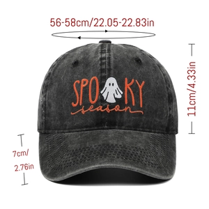Detail of Spooky Season orange embroidery and white ghost on washed black baseball cap