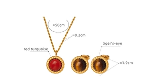 Detail of gold jewelry set with red turquoise necklace and tiger's-eye earrings